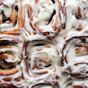 banana cinnamon rolls topped with cream cheese glaze.