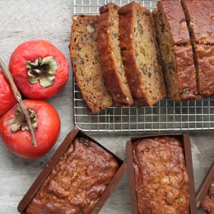 walnut persimmon cake cooling on rack.