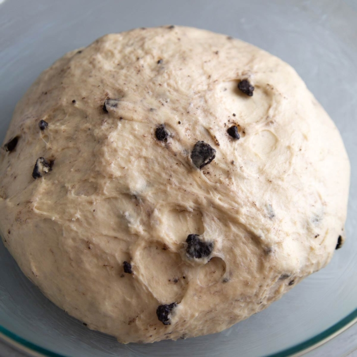 rested dough studded with chopped oreo cookies in bowl.