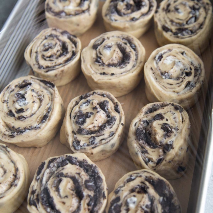 place cut rolls in a baking dish to rest and rise.