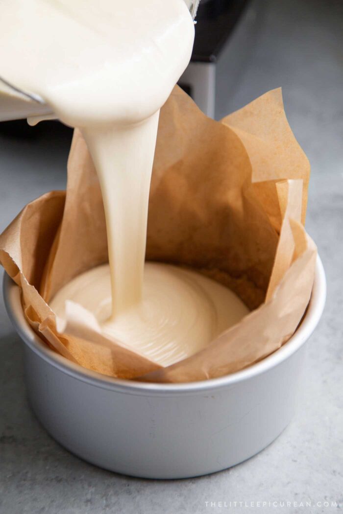 pour filling into parchment lined cake pan.