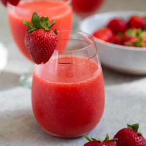 Frozen strawberry daiquiri made with frozen strawberries, light rum, lime juice, and simple syrup