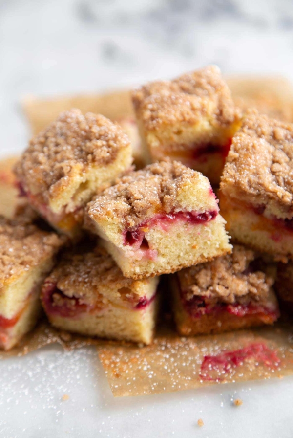 Plumcot Crumb Cake featuring vanilla cake with sliced plumcots and spiced crumble topping