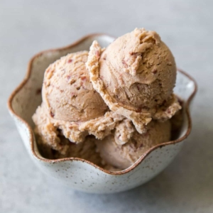 3 scoops of red bean ice cream in a white bowl.