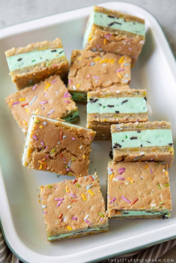 mint chocolate chip ice cream sugar cookie sandwiches arranged on serving platter.