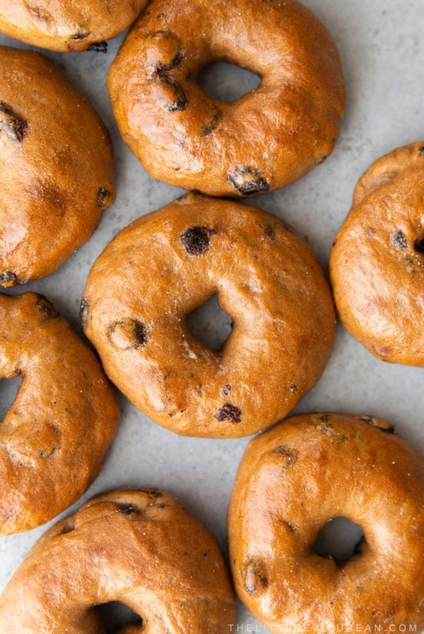 cinnamon raisin bagels arranged close together.