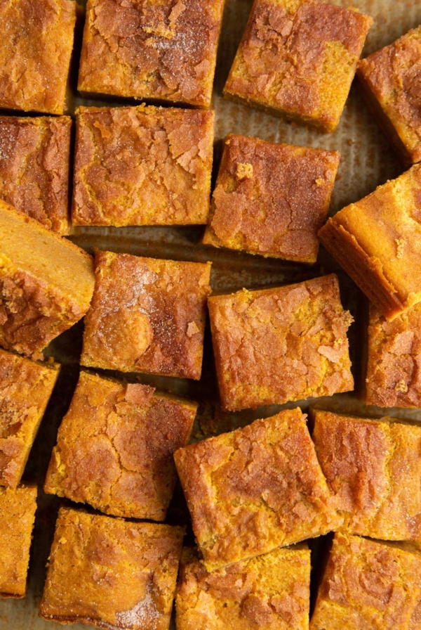 sliced portions of pumpkin butter mochi topped with cinnamon sugar.